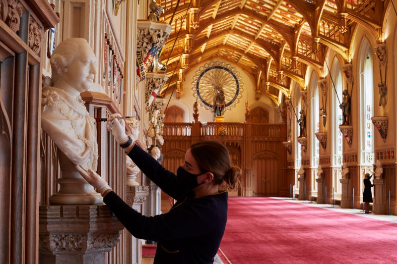 Members of staff dust marble busts in St George’s Hall